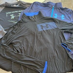 Set of 3 Under Armour long sleeved, Youth XL Loose fit, long sleeved tops.